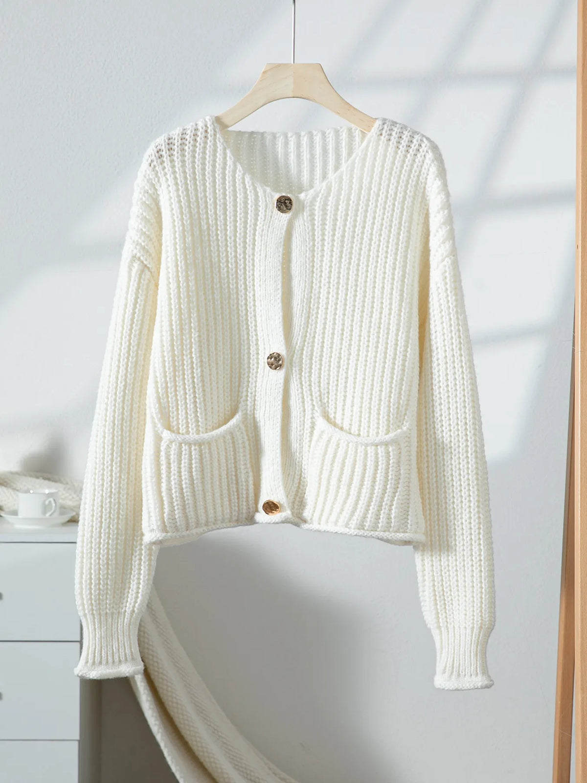 ivory button front knit cardigan with pockets close up of the neckline