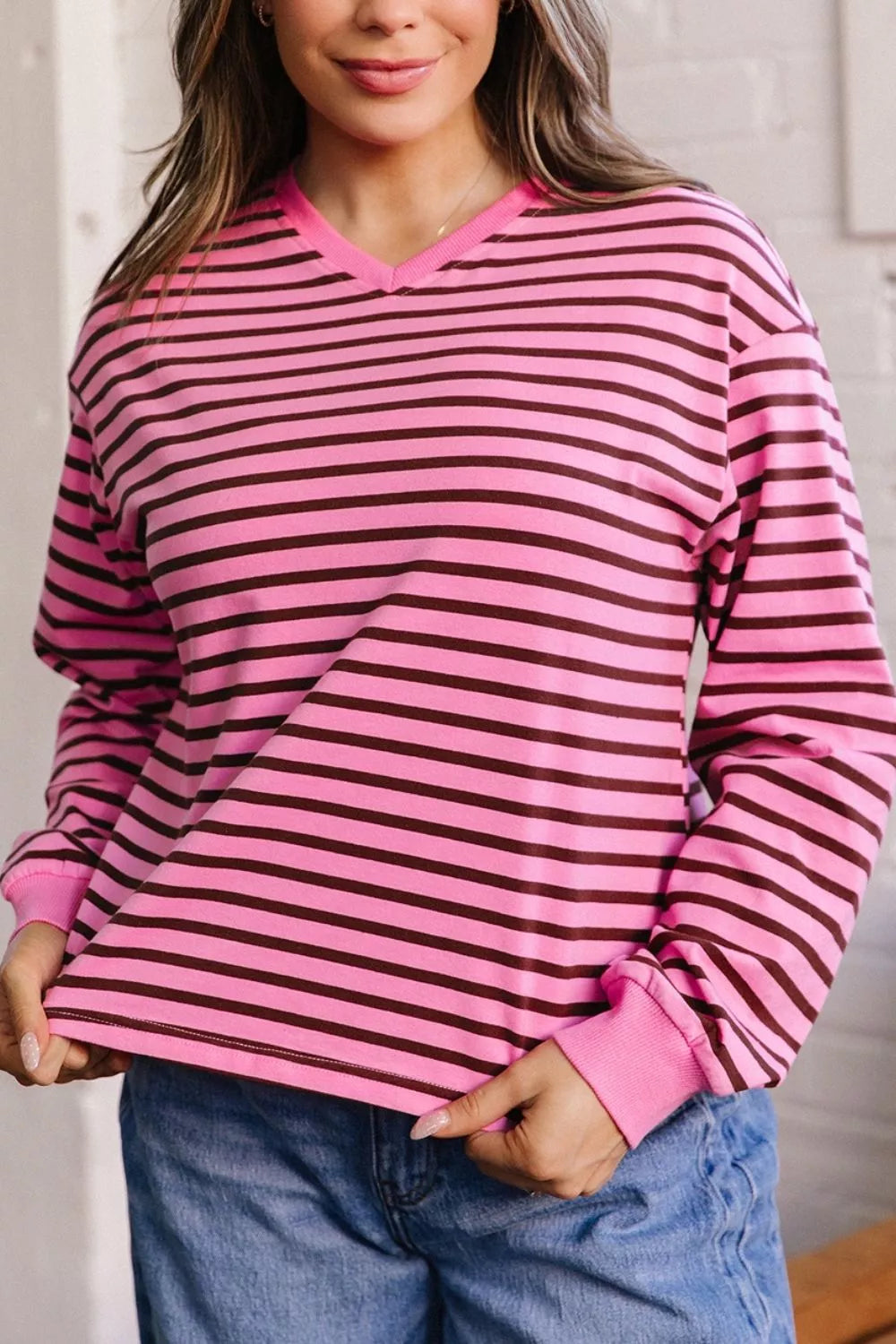 Back view of the fuchsia pink striped long sleeve top