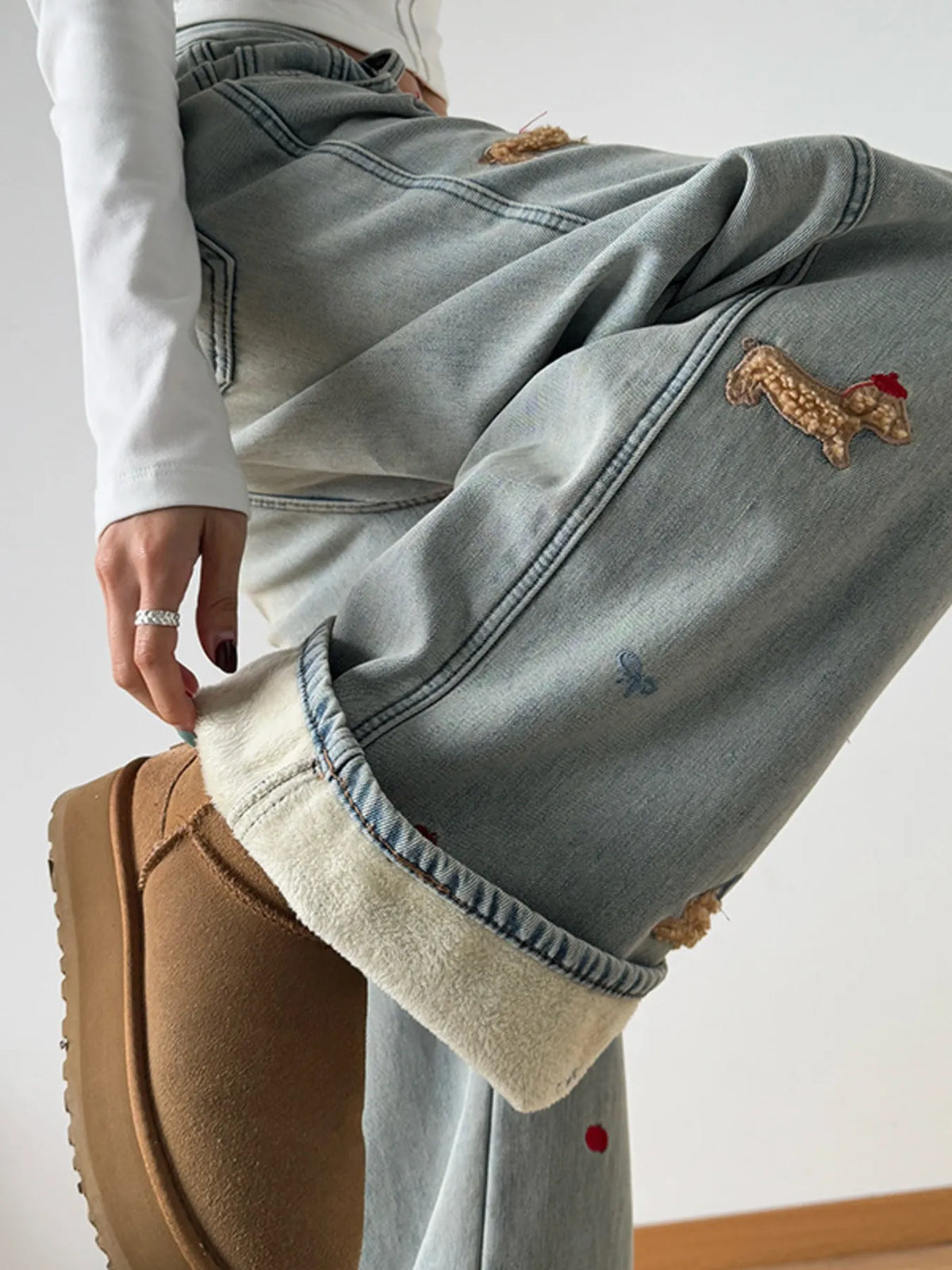 Light wash embroidered wide leg jeans side profile