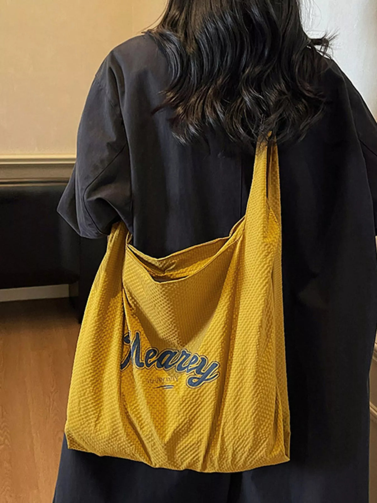Yellow nylon bag styled with an outfit