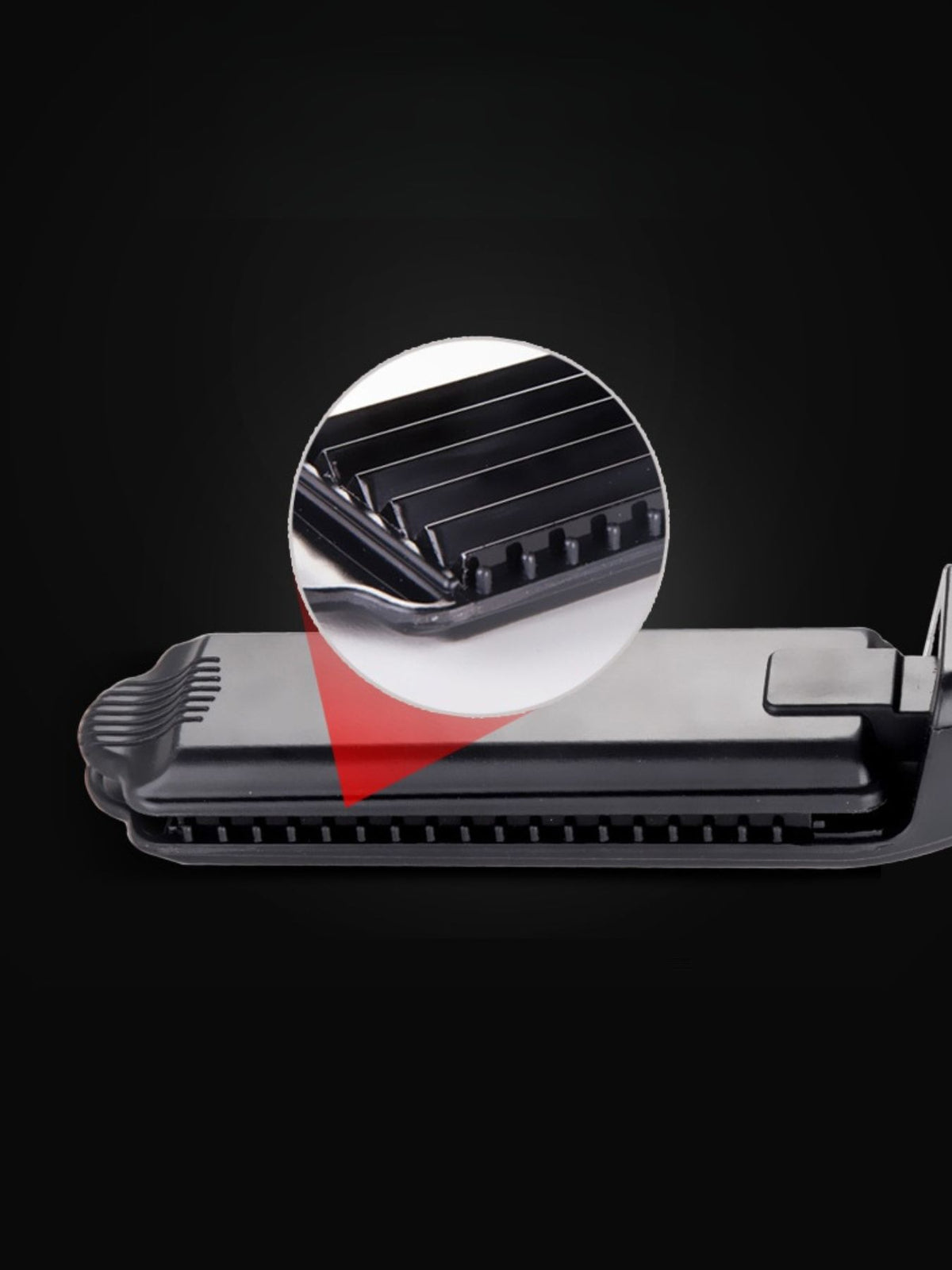 Hair straightener held in hand