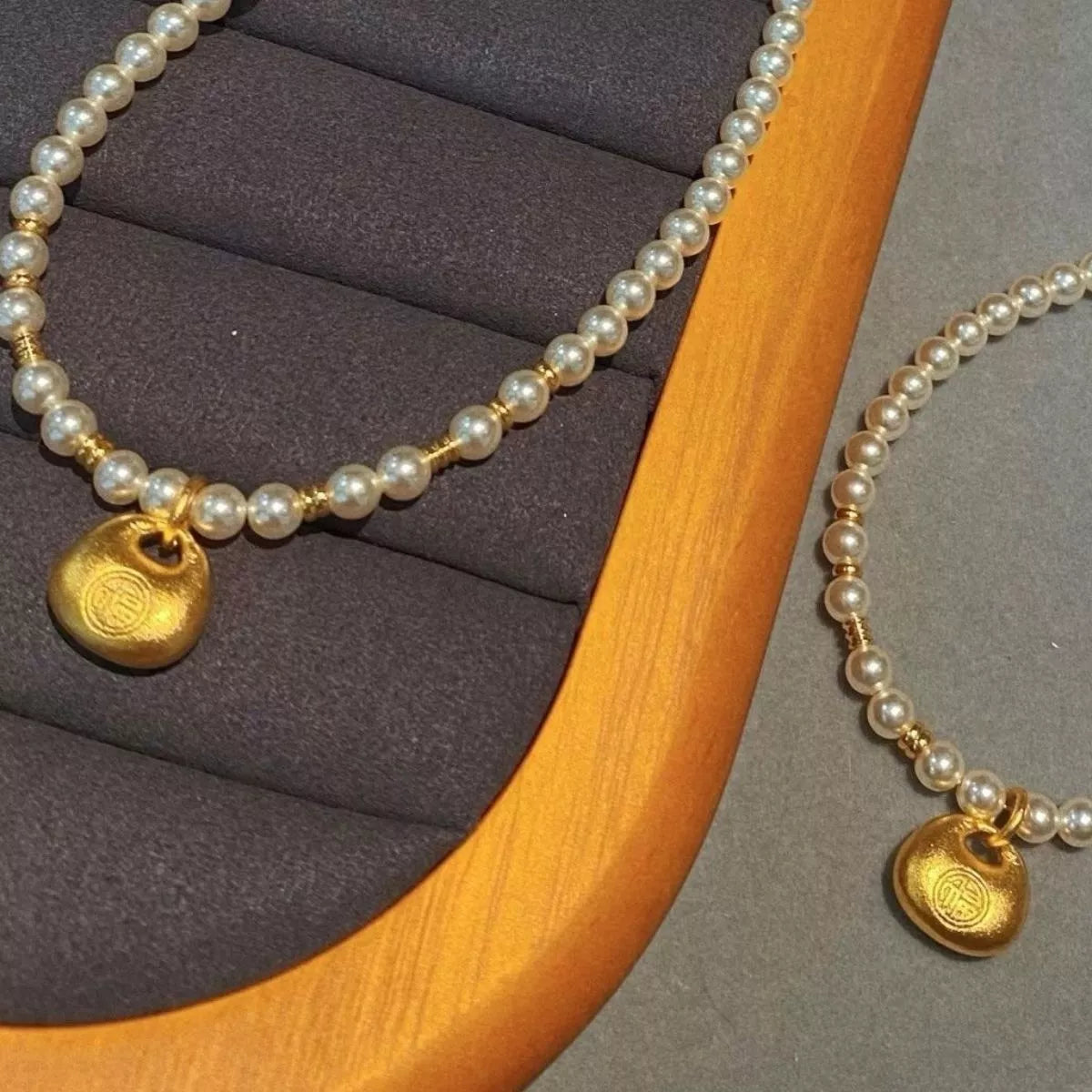 pearl necklace with gold pendant styled on model