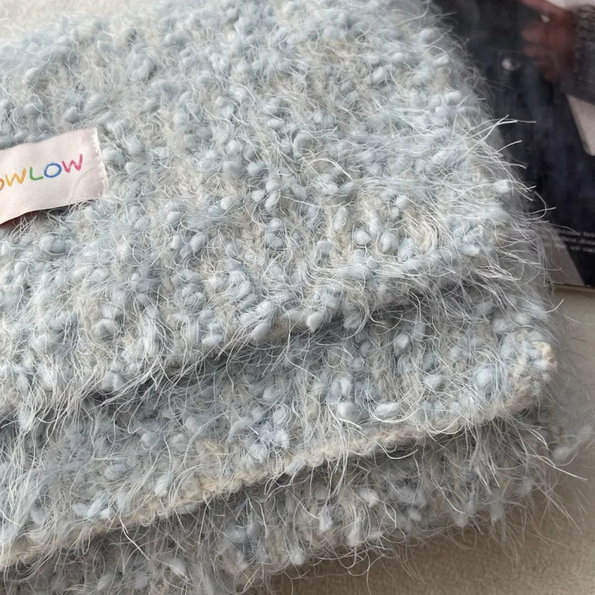 Cozy plush winter scarf laid flat to show the length