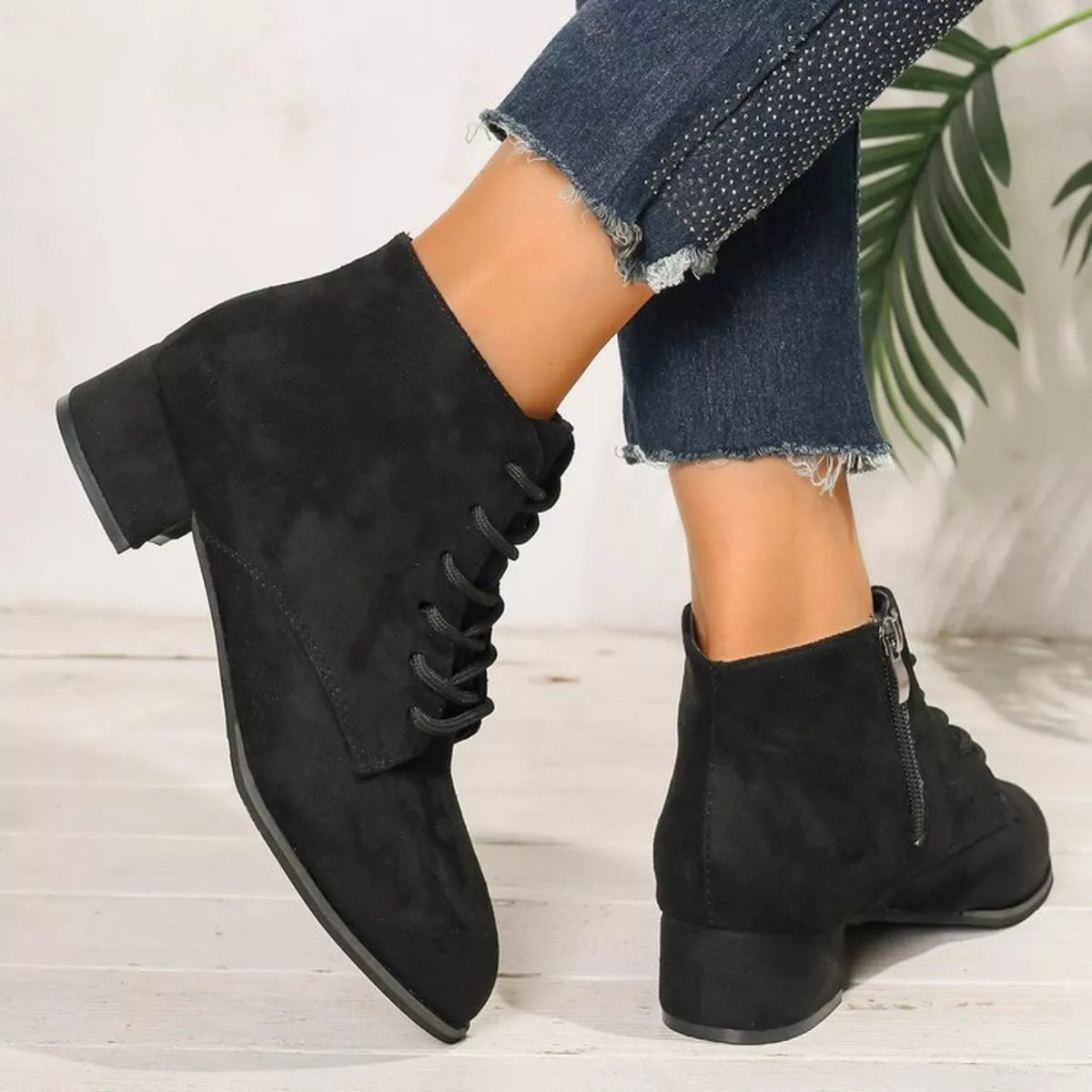 black lace up block heel boots styled on model