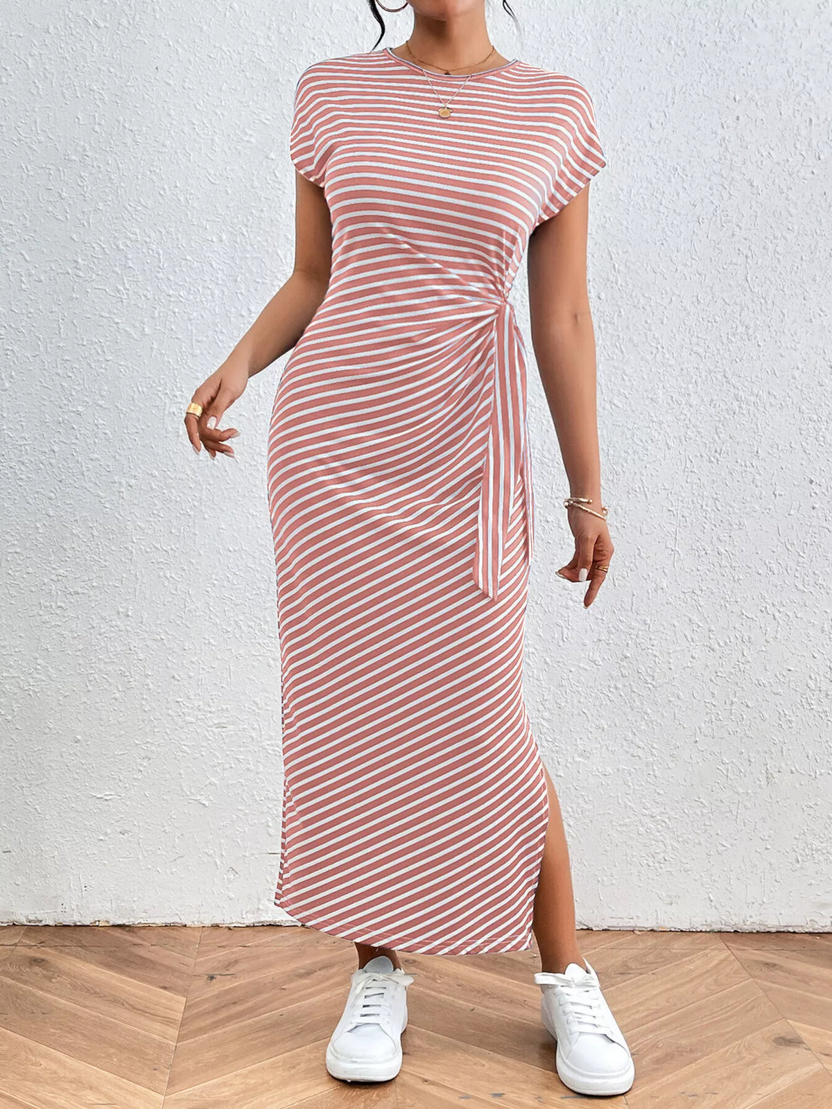Yellow striped dress with tie waist, three quarter angle