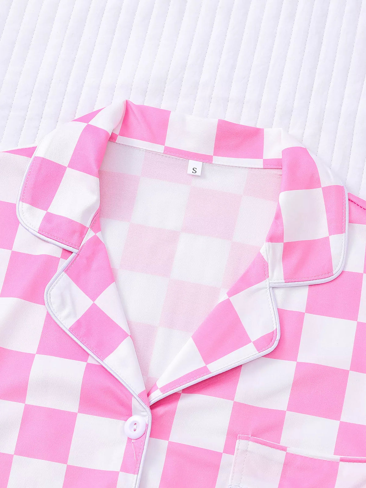 Checkered short sleeve button up top detail