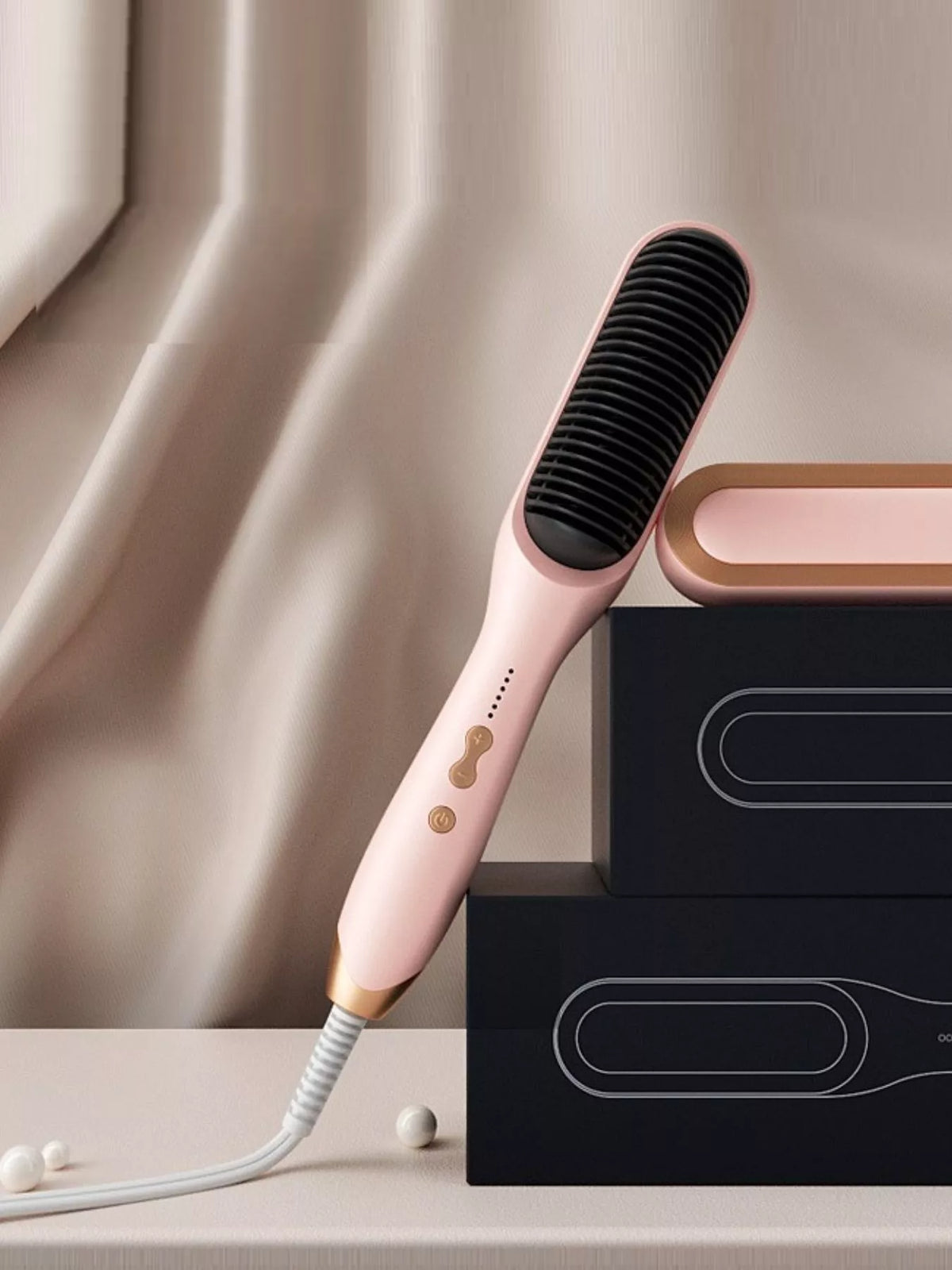 Heated straightener in hand