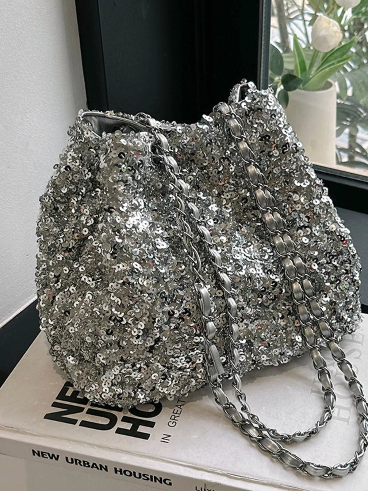 Sequin bucket bag styled for evening