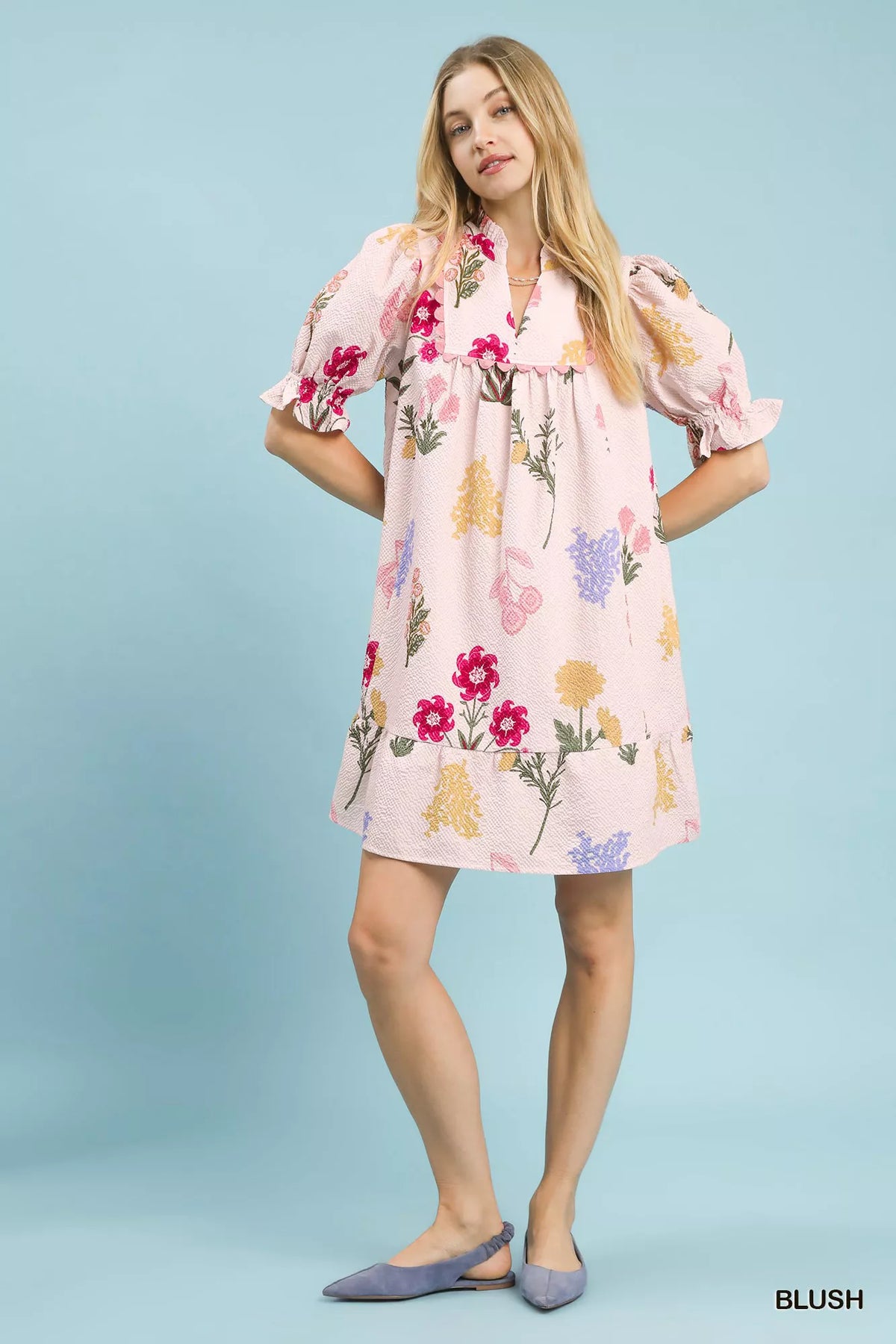 Back view of the blush floral tiered dress