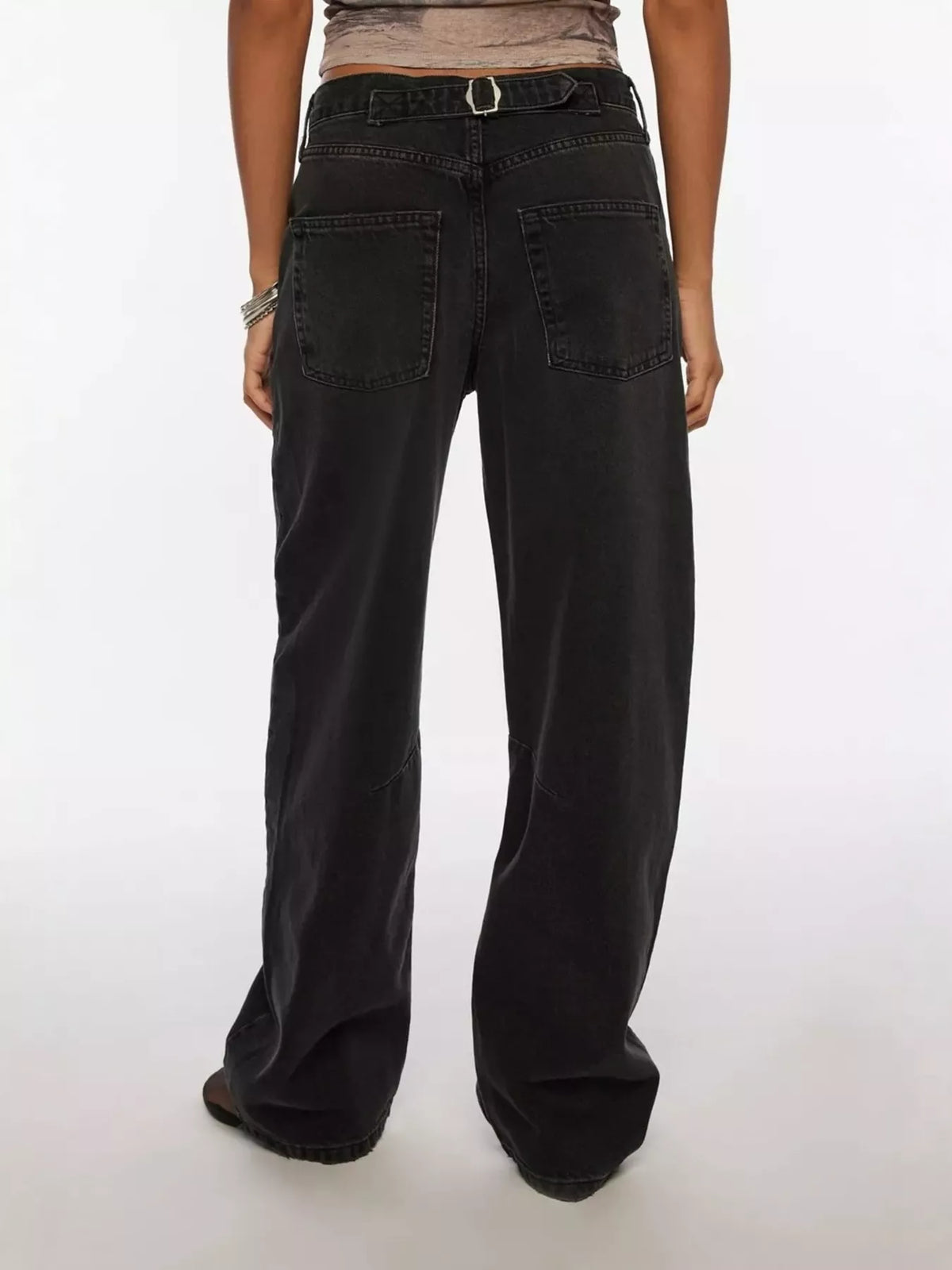 Buttoned waist on black wide leg jeans