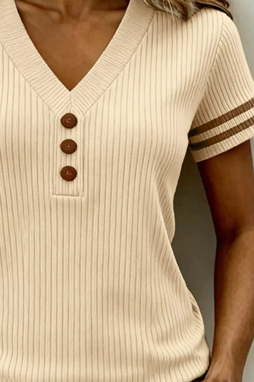 Ribbed V neck knit top with decorative button detail