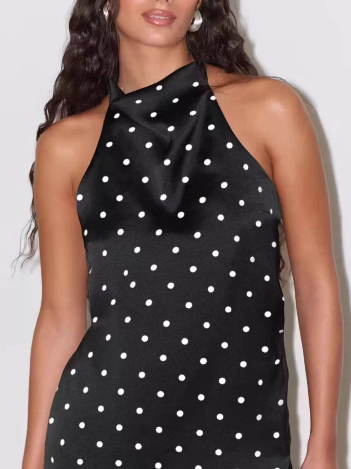 Full length view of the polka dot halter top on a model