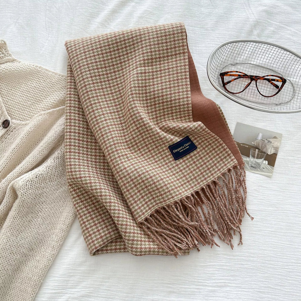 Close view of the plaid pattern on the fringe scarf