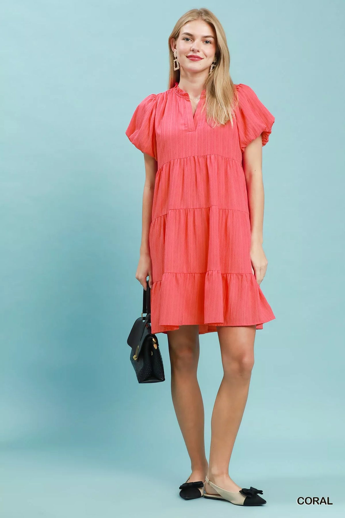 Coral puff sleeve tiered babydoll mini dress detail view