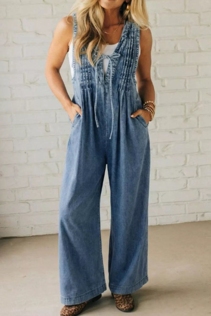 Acid wash denim wide leg jumpsuit in dusty blue, front view