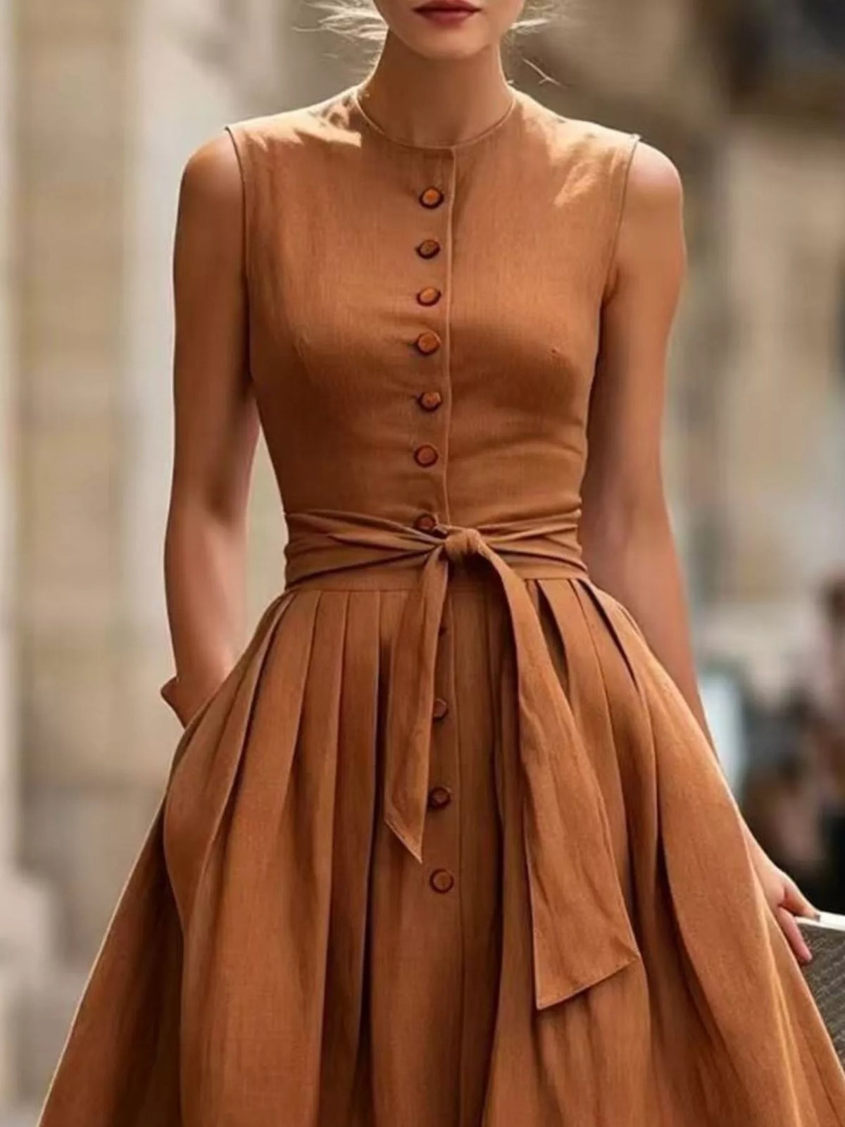 Midi dress shown in black with the belt tied