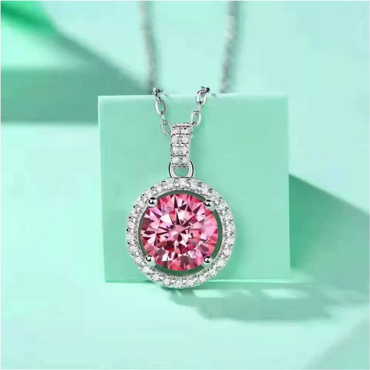 Close up of the blush pink moissanite pendant stone