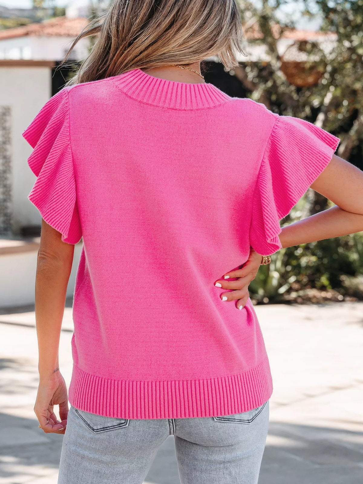 Pink round neck knit sweater side view