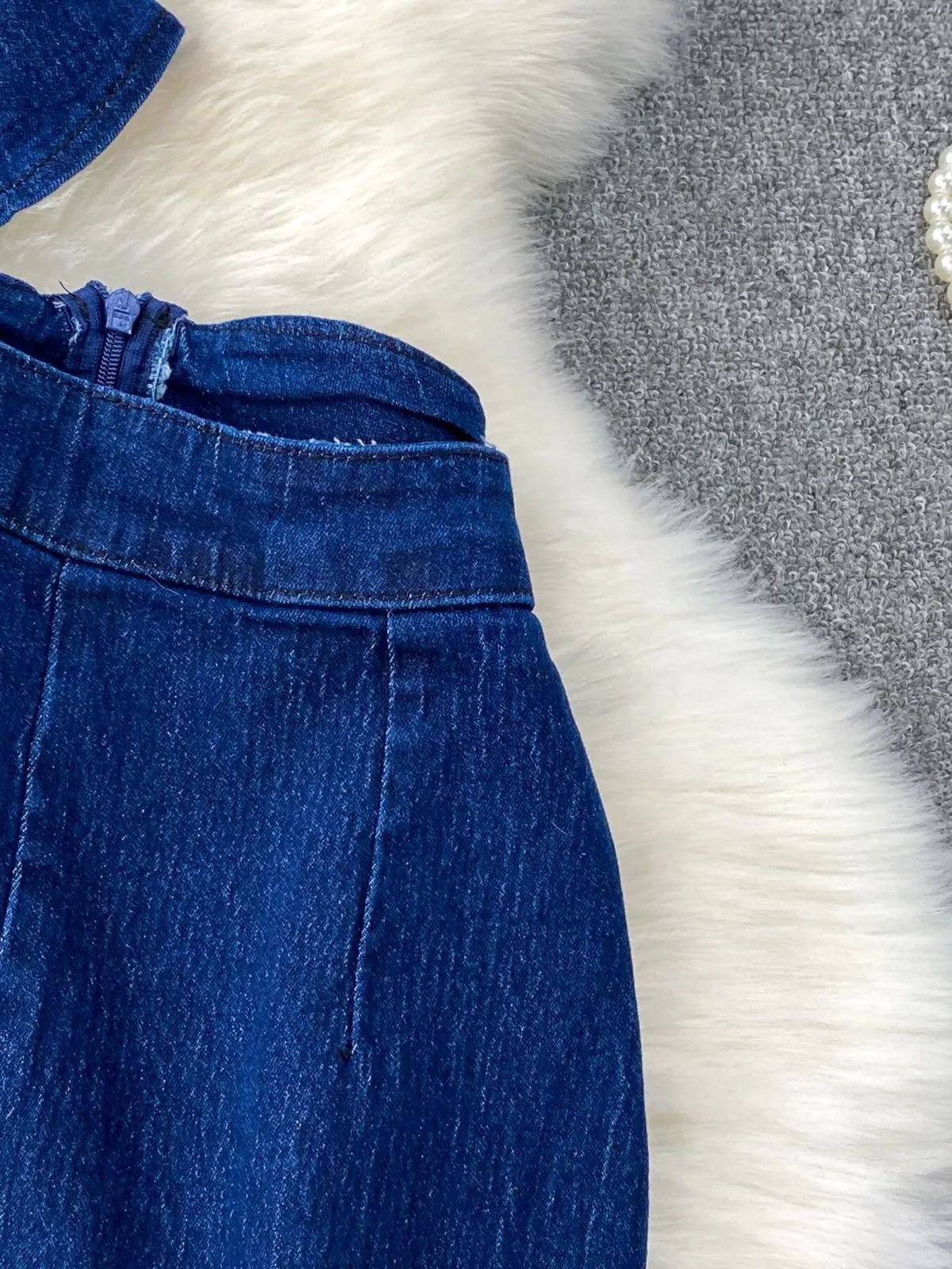 Denim vest button closure detail