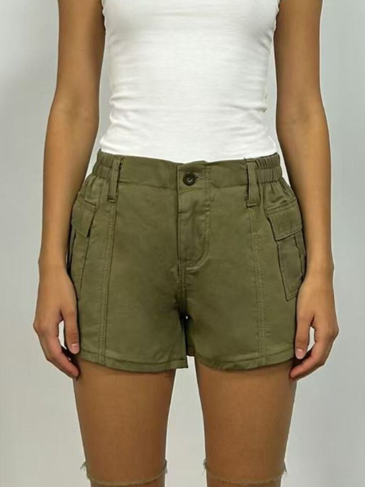 Casual shorts worn with a tucked tee