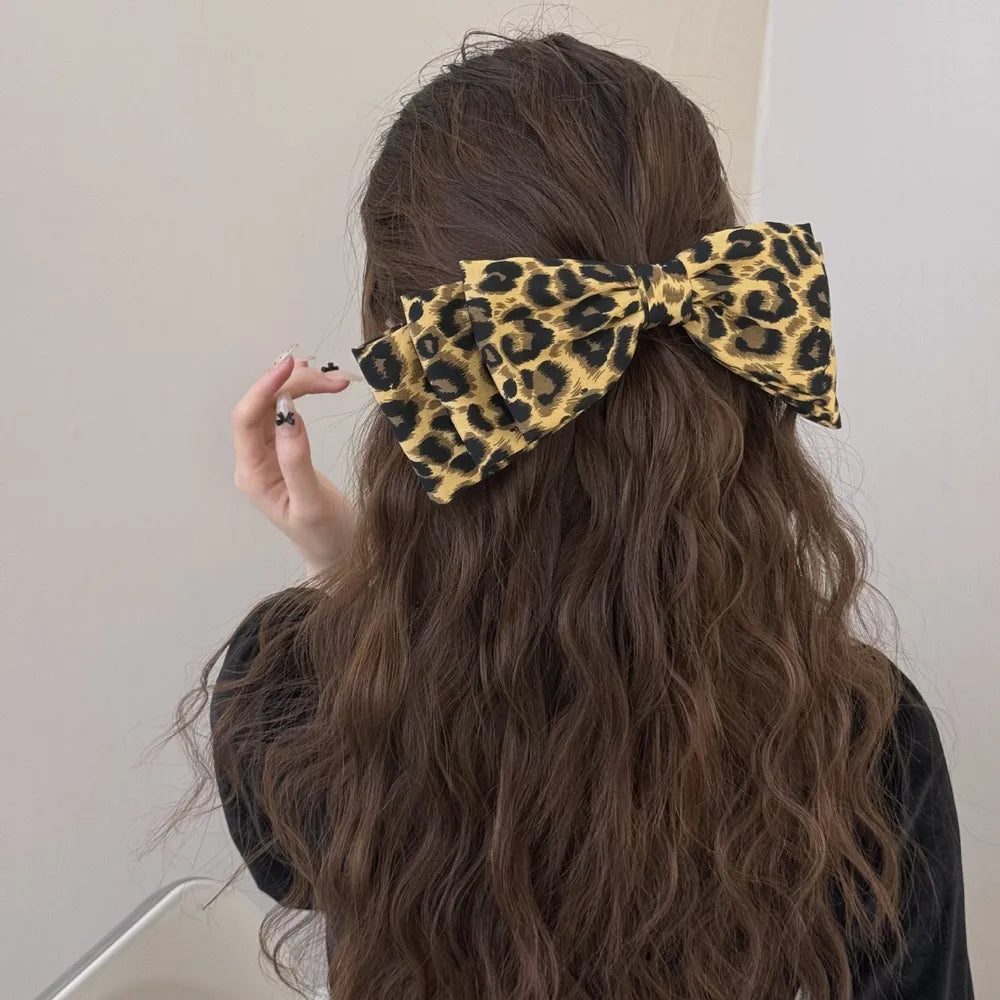 Leopard bow hair clip print close up