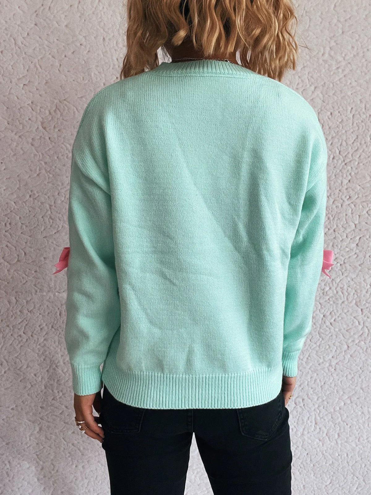 Bow round neck long sleeve sweater close up detail
