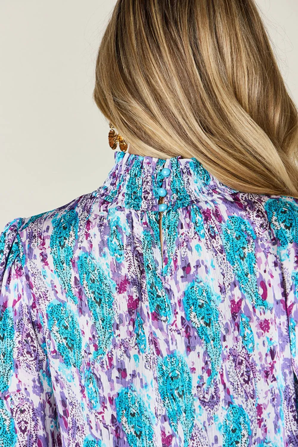 Frill trim detail of the printed blouse