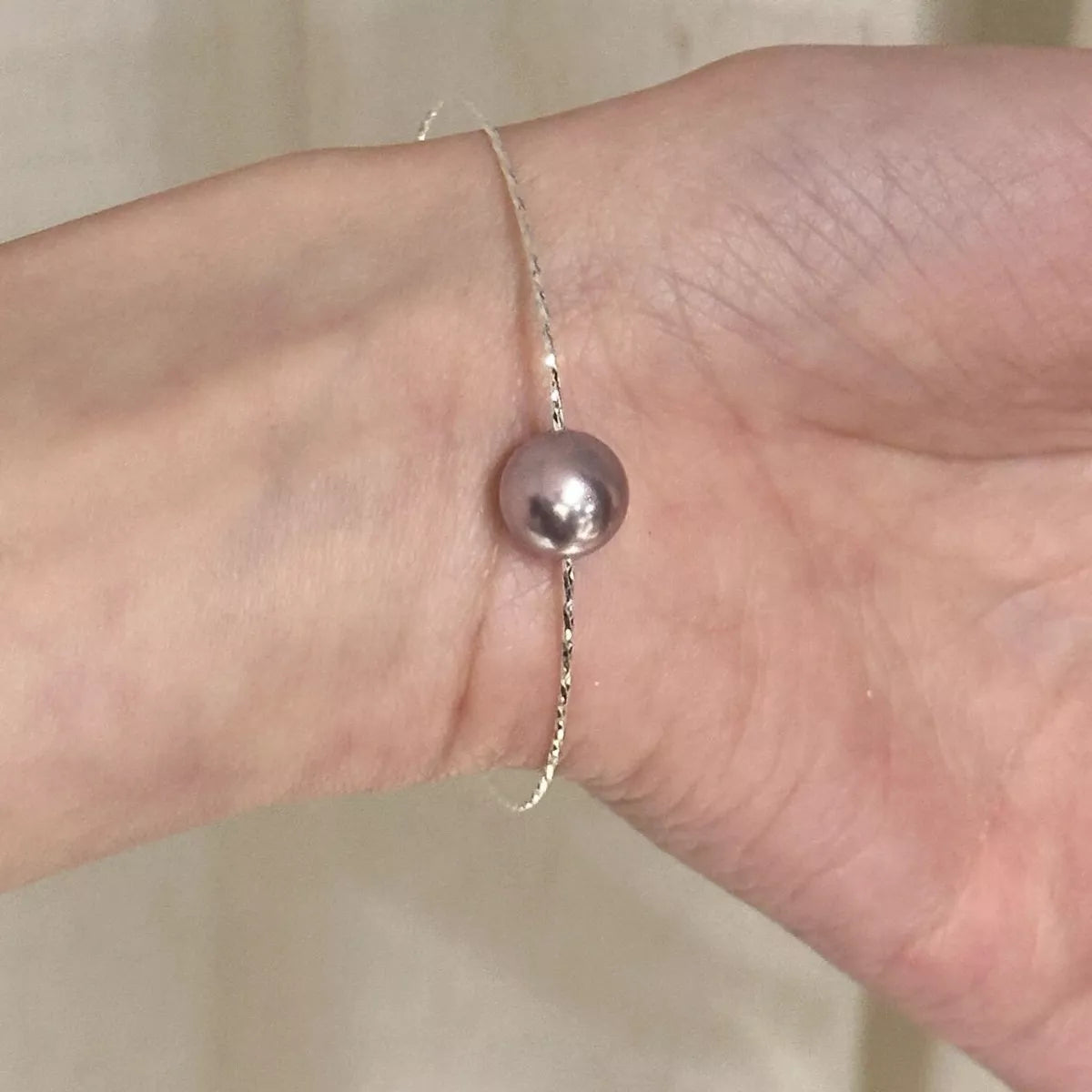 Silver pearl bangle bracelet close up view