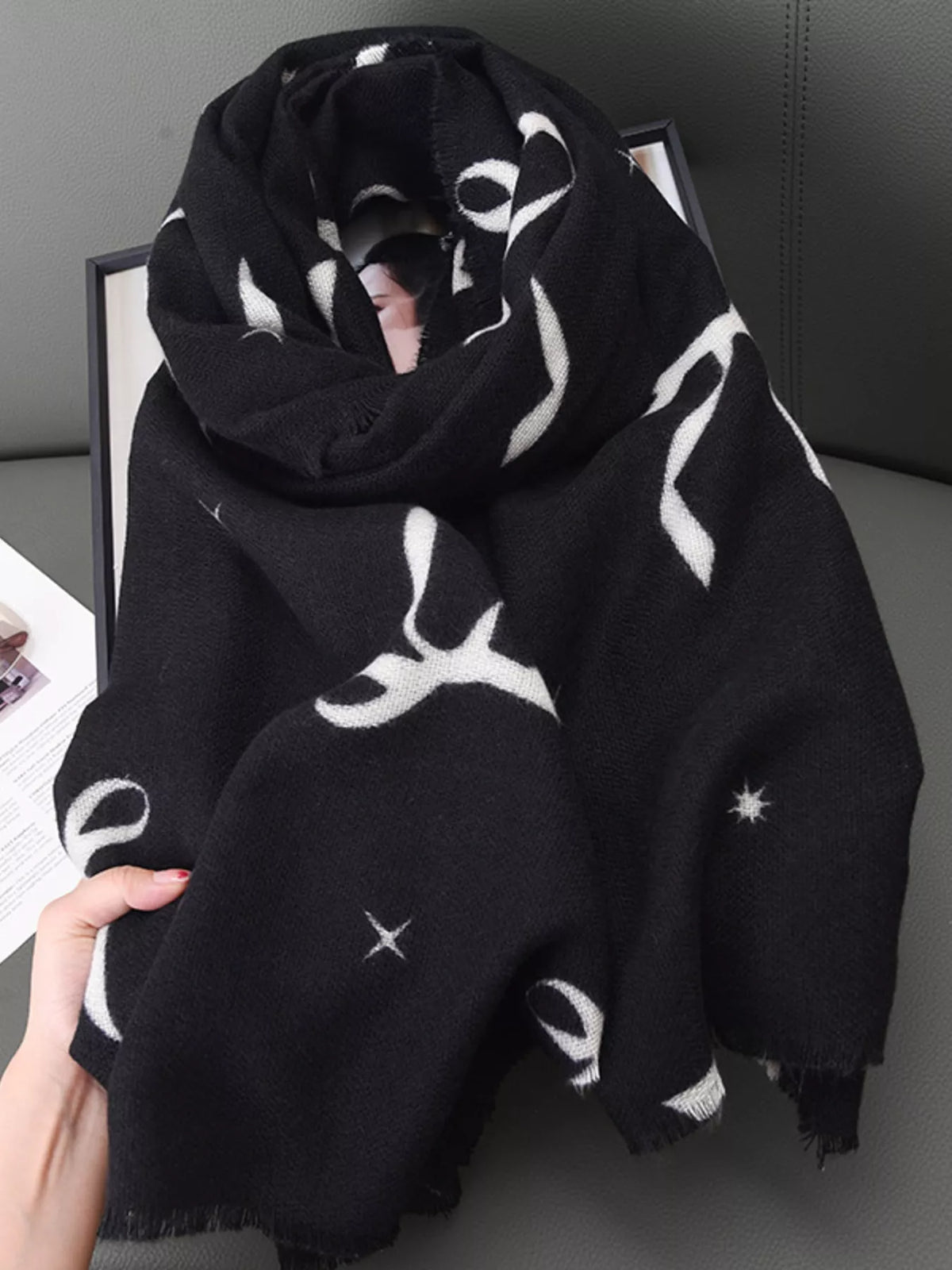 Bow print scarf knotted at the side