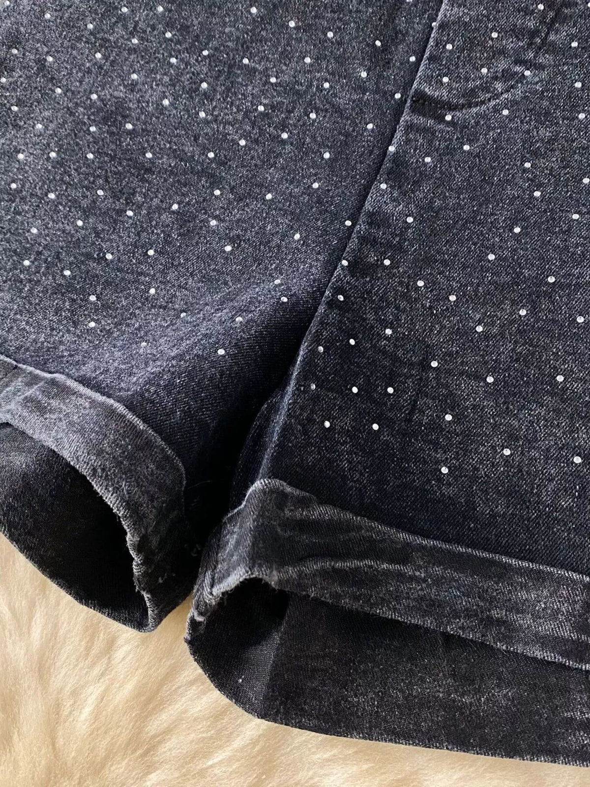 Blue strapless denim romper with diamante detail close up view
