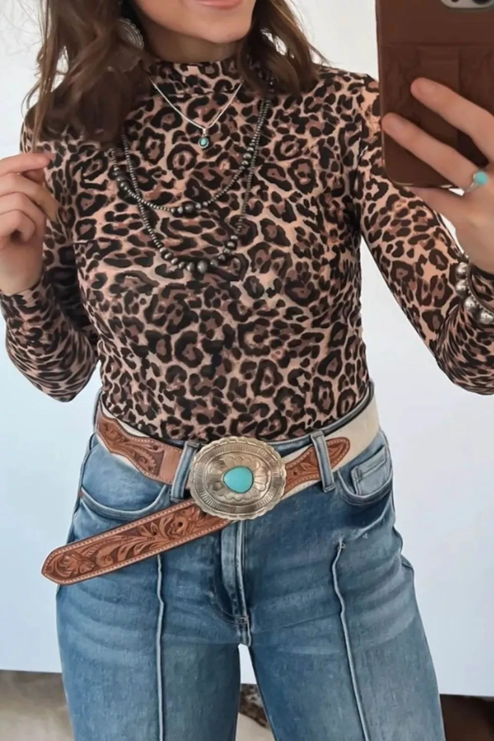 Slim fit long sleeve top shown at a side angle