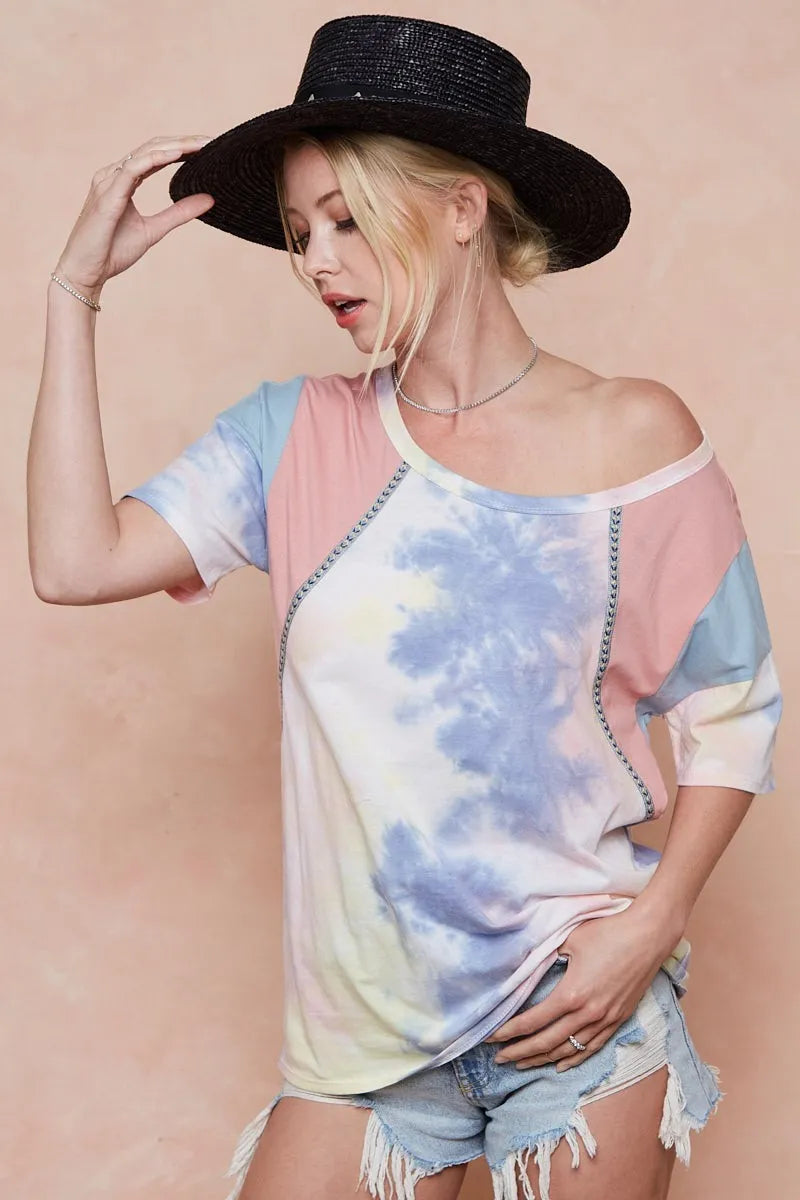 Pink and blue tie dye top styled with jeans