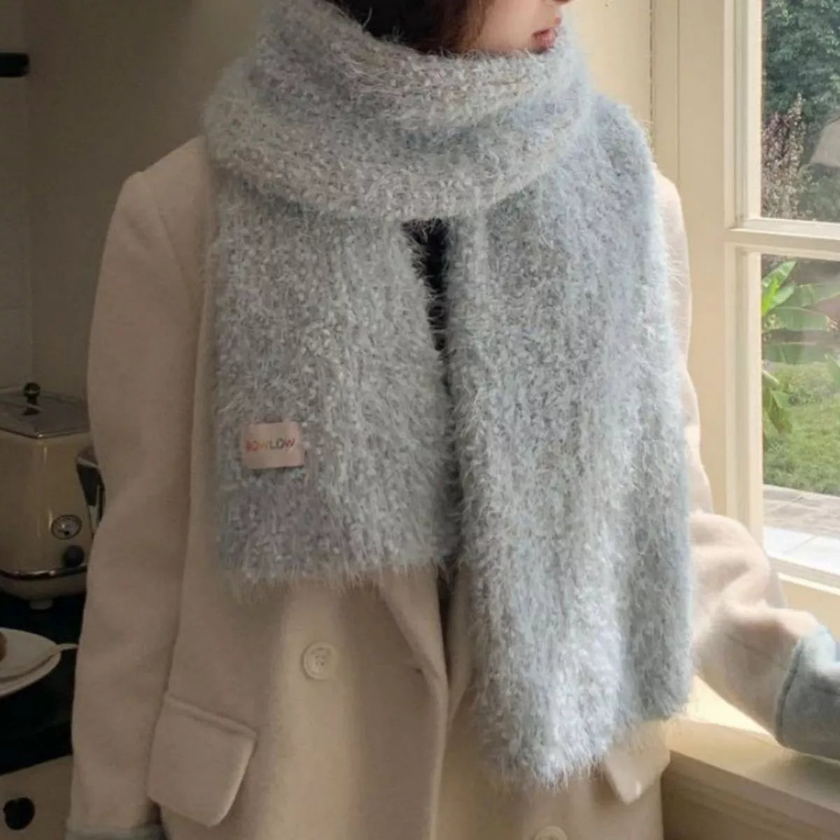 Soft plush scarf shown in a bright color option