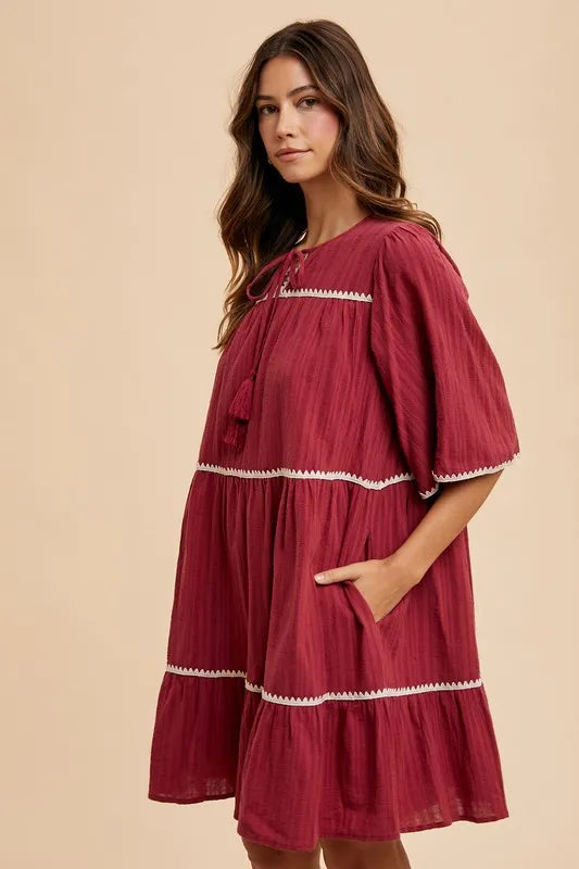 Tassel Tie Neck Tiered Dress in Burgundy back view