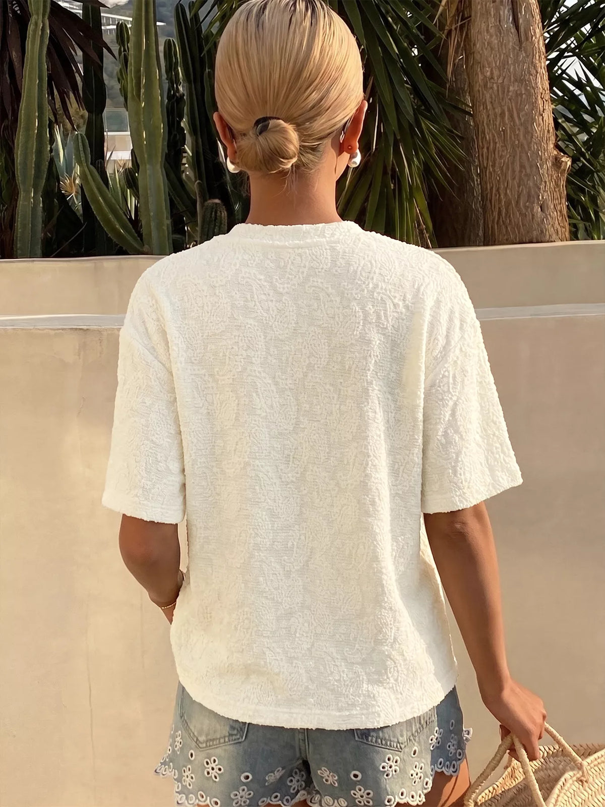 Apricot textured paisley pattern short sleeve t-shirt close up view