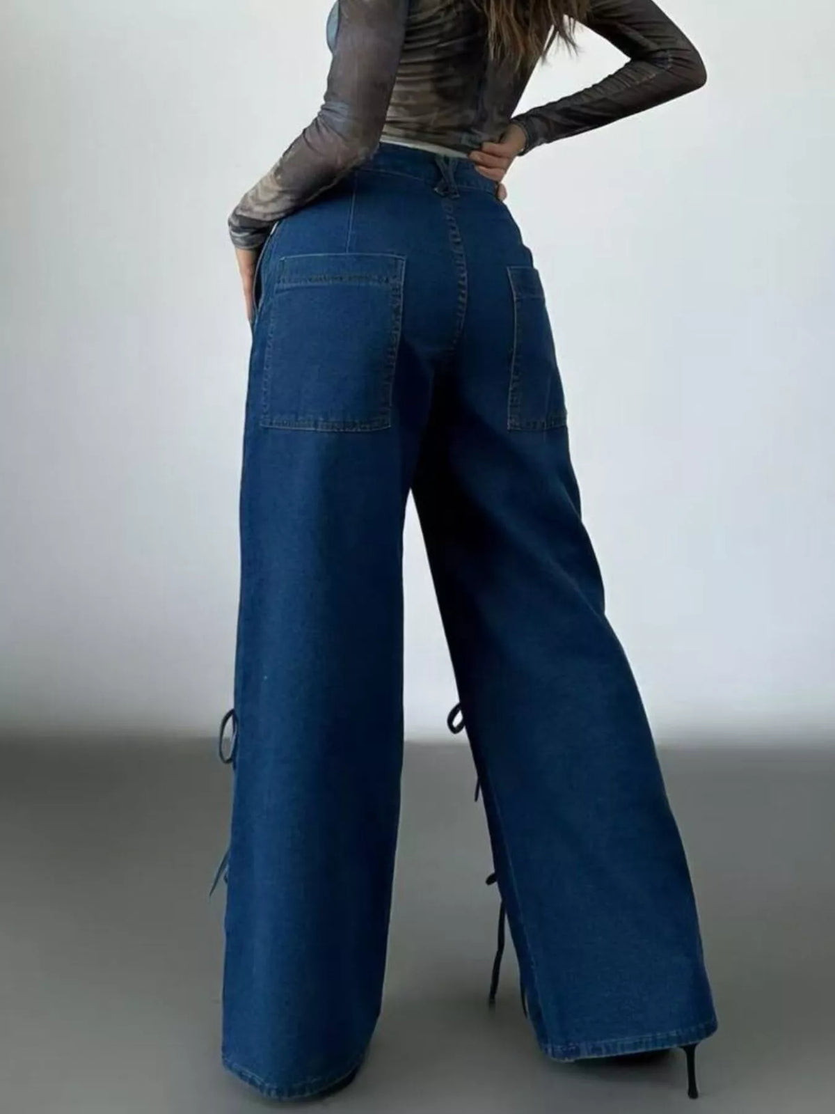 Model wearing lace up wide leg denim