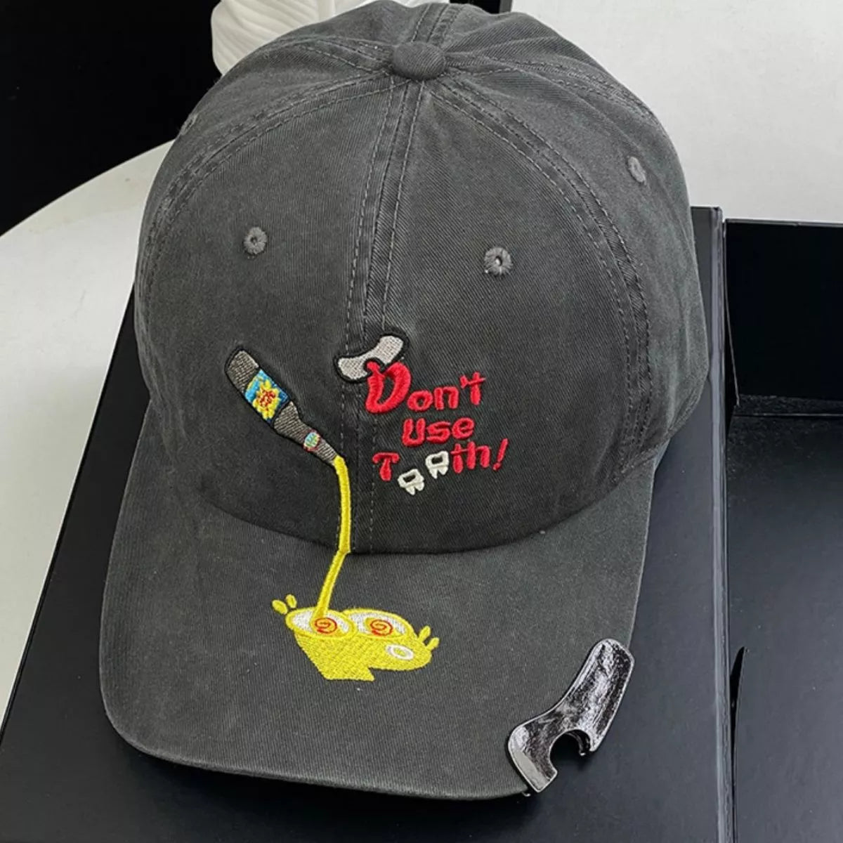 Side view of the baseball cap showing the curved peak and soft crown