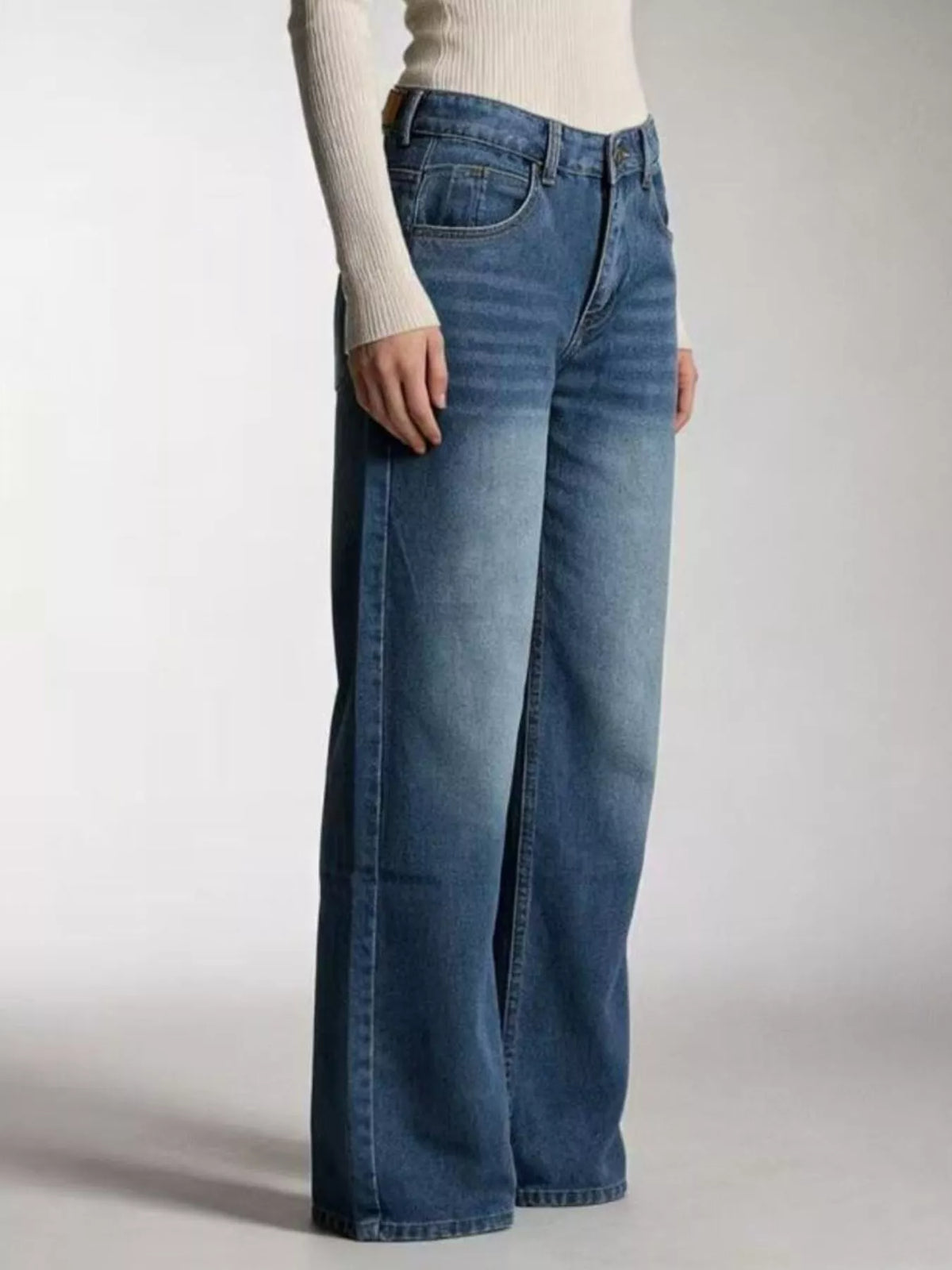 Vintage wash jeans styled with a tucked shirt
