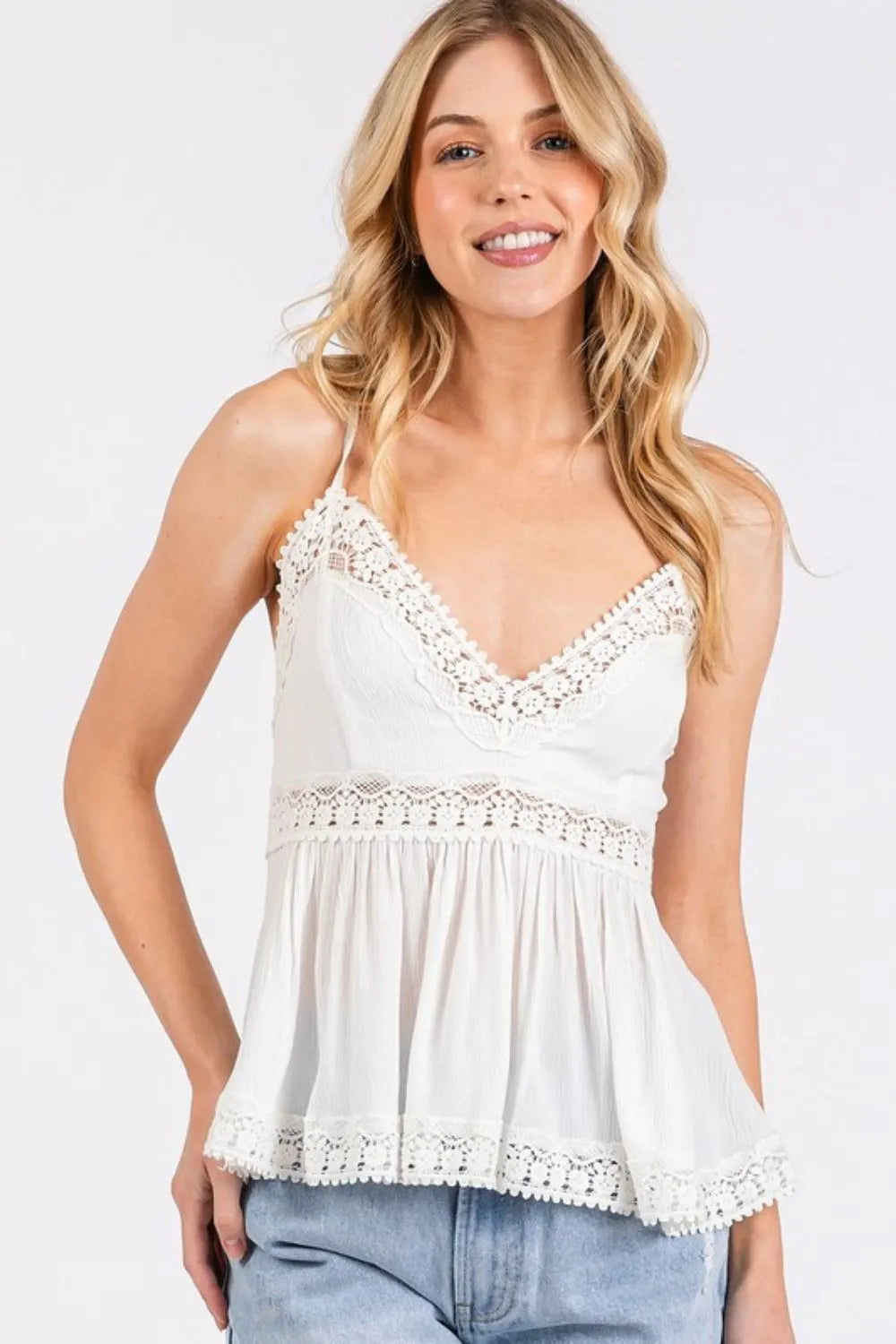 Crisscross tie back detail on ivory lace cami top
