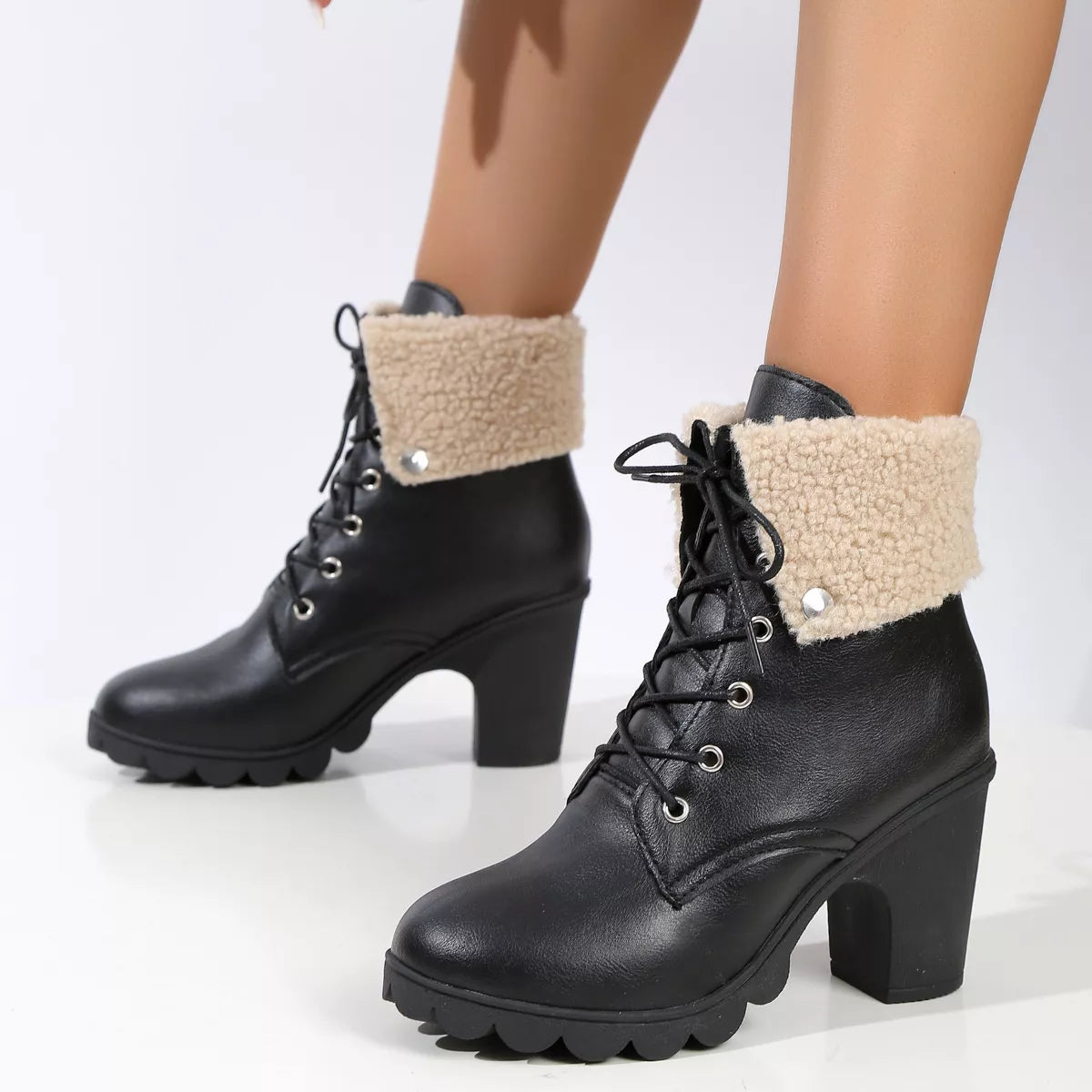 Lace up block heel boots styled on model