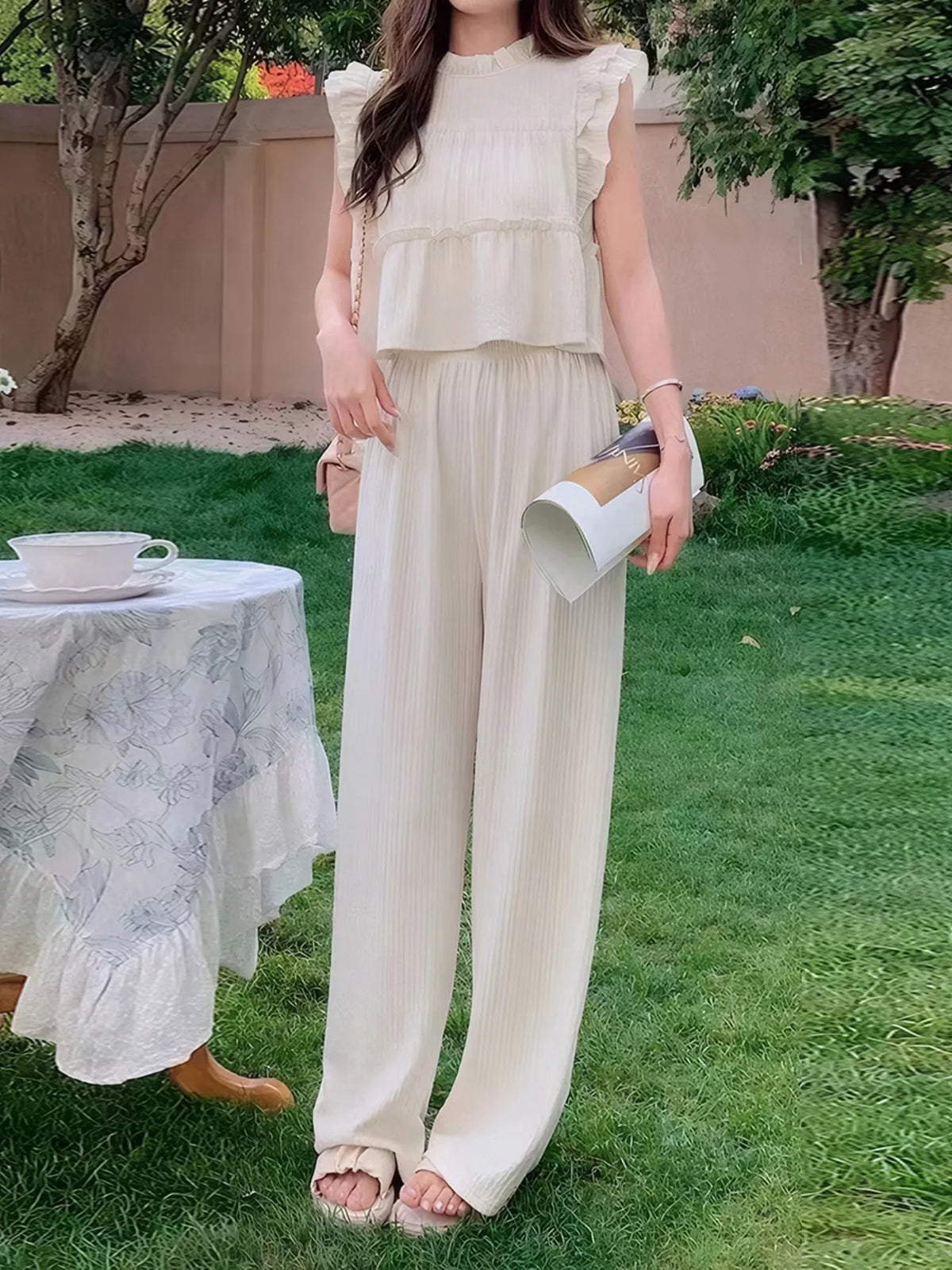 Apricot ruffle top and wide leg trousers two piece set