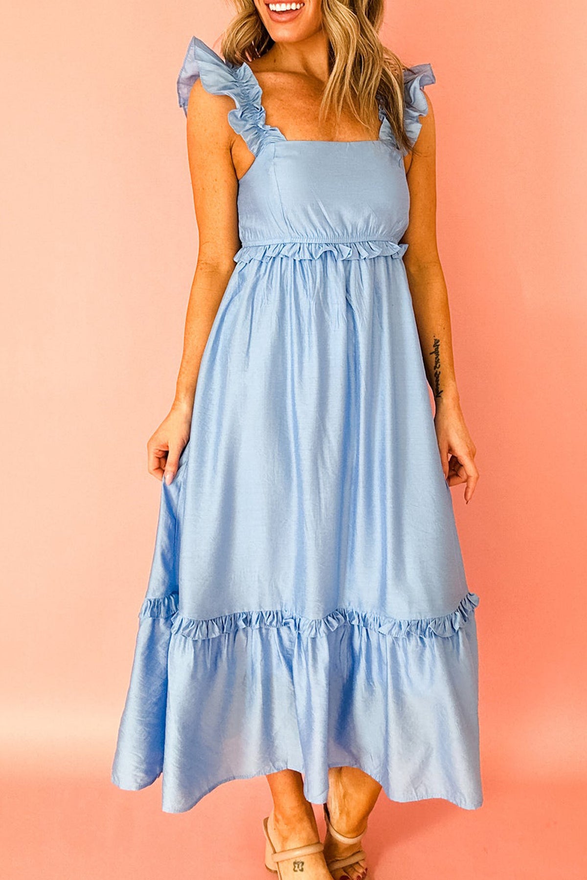 Blue maxi dress styled for a formal occasion