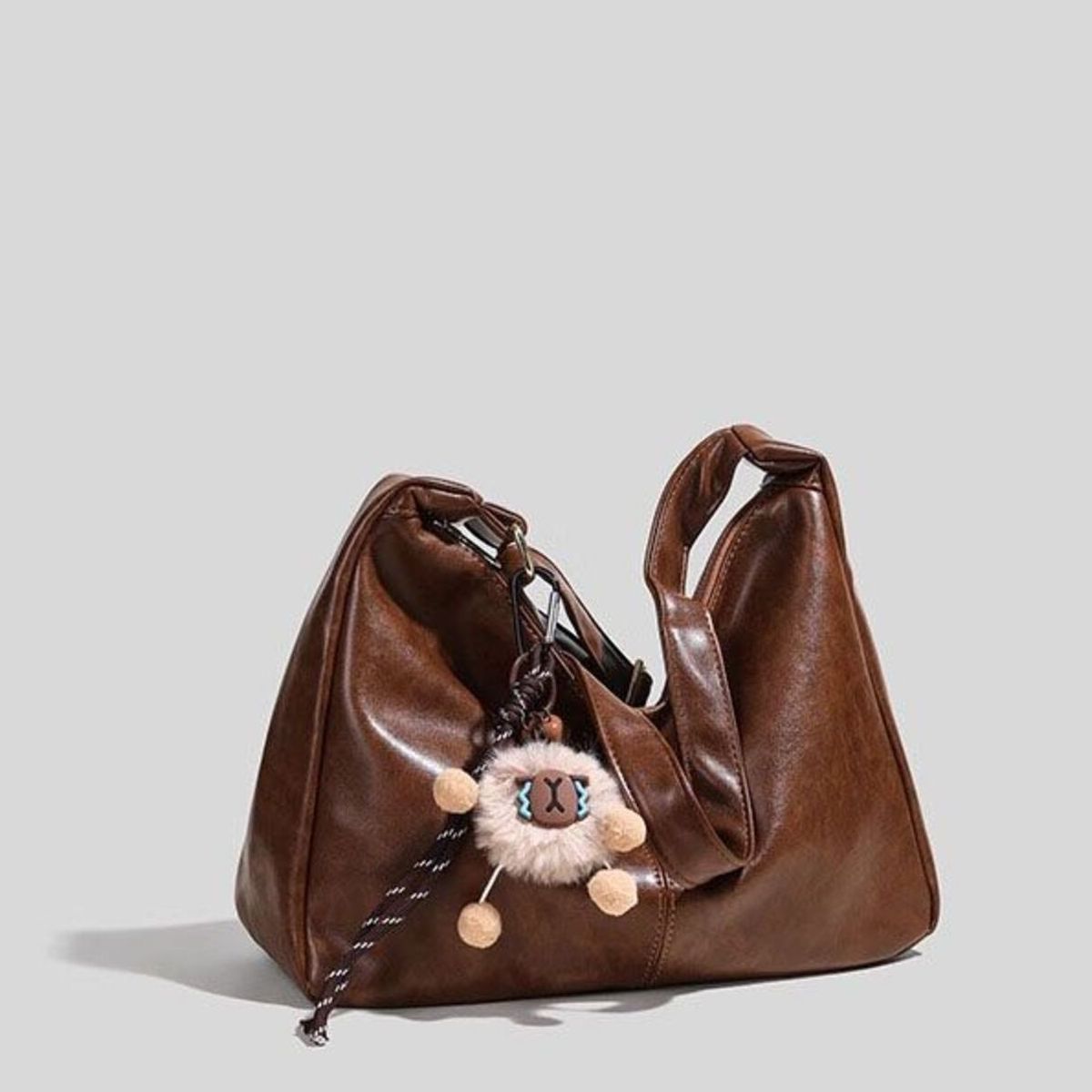 Leather hobo bag held by model