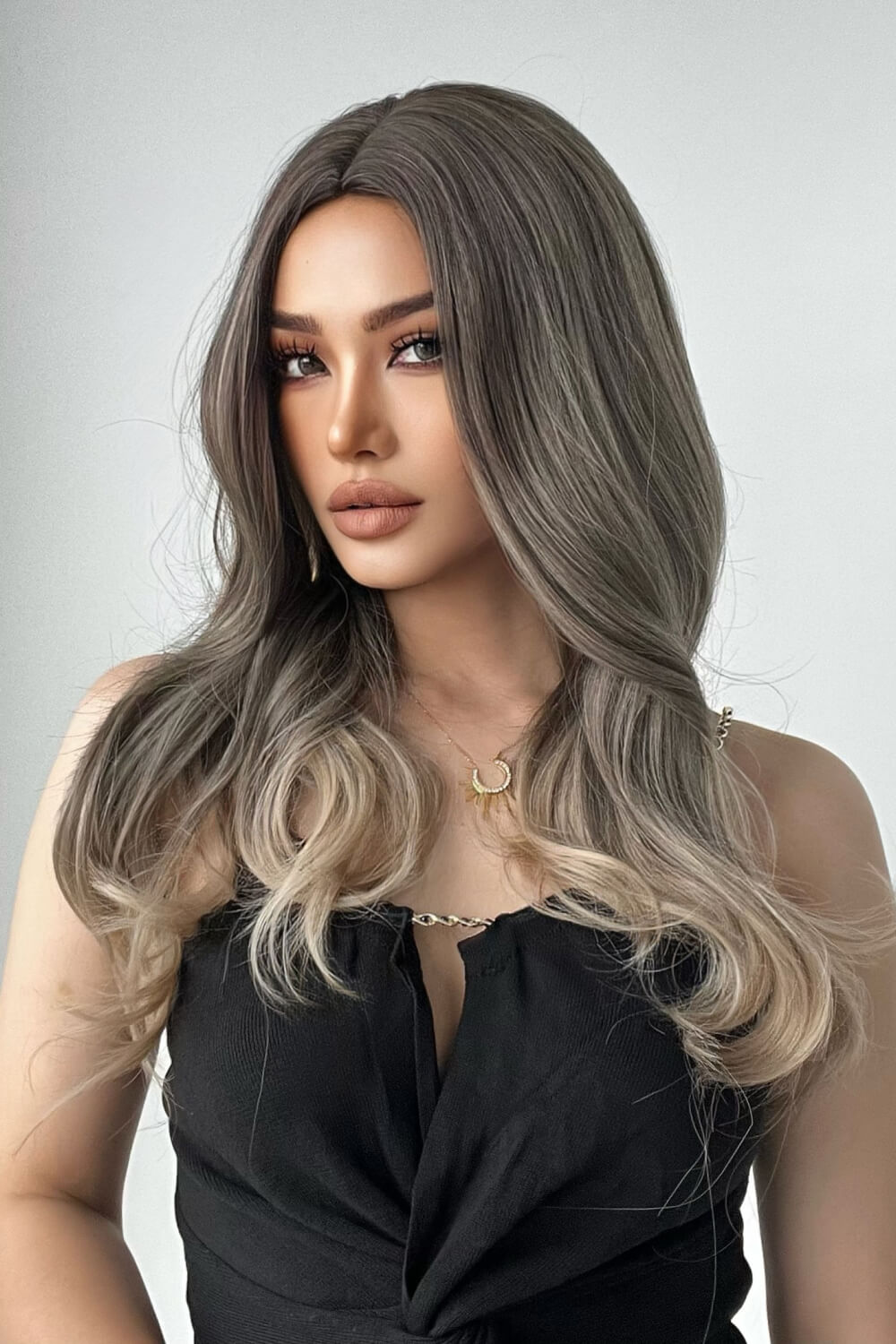 Styled long straight synthetic wig on mannequin
