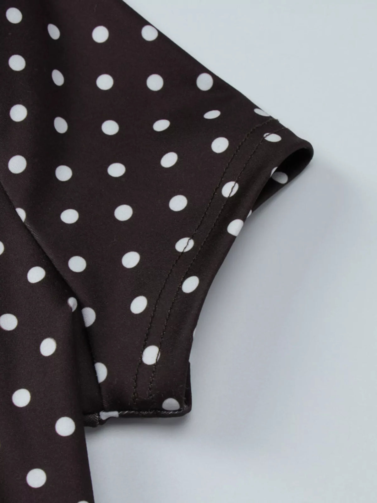 Close up of brown polka dot print fabric