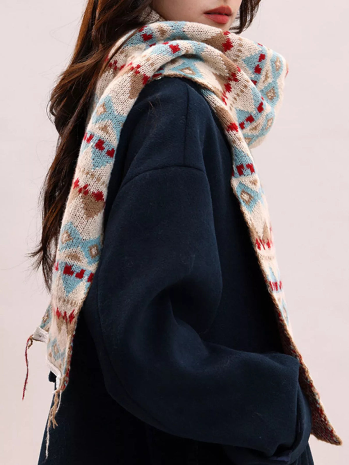 Geometric knitted scarf shown in one pattern style