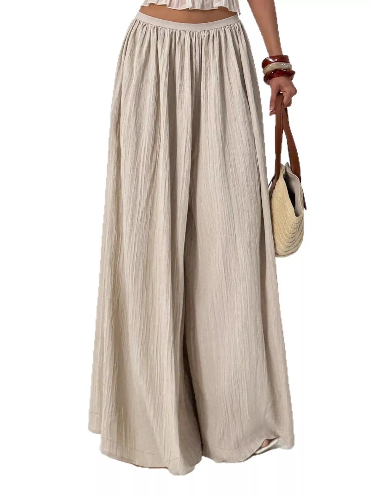 Walking view showing the drape of the wide leg khaki pants