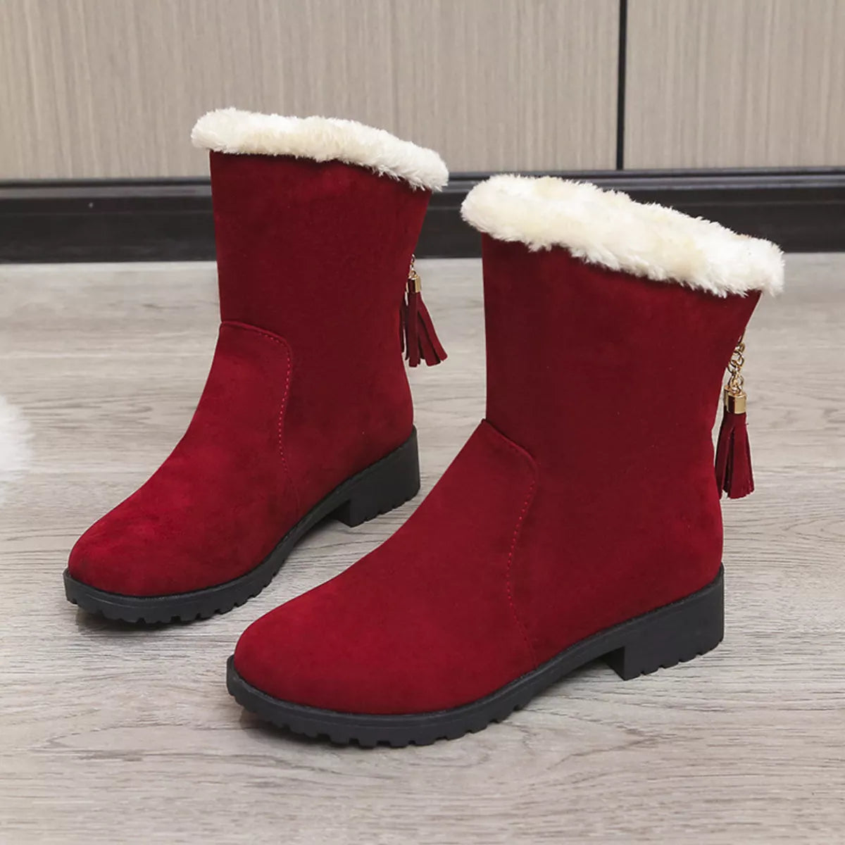 Round toe plush lined suede boots sole view