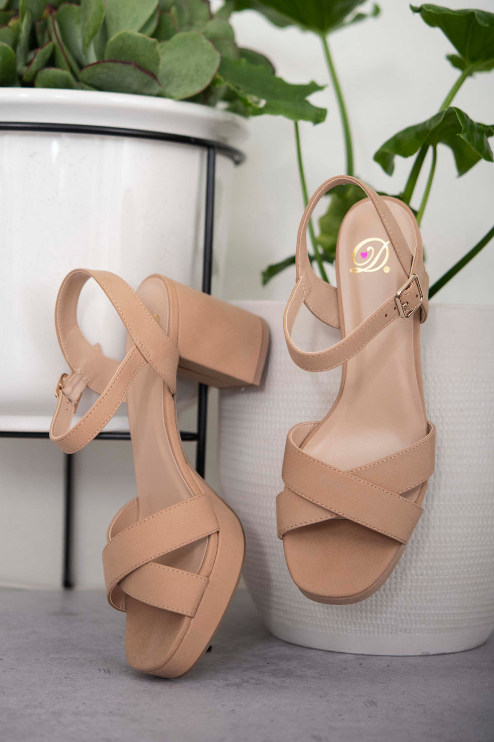 Nude block heel sandals shown as a pair