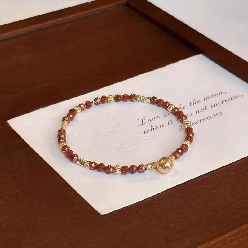 Beaded charm bracelet on wrist
